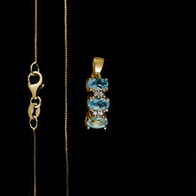 Load image into Gallery viewer, 9ct Yellow Gold Curved Blue Topaz & Diamond Trilogy Pendant (0.01ct) - Optional Chain